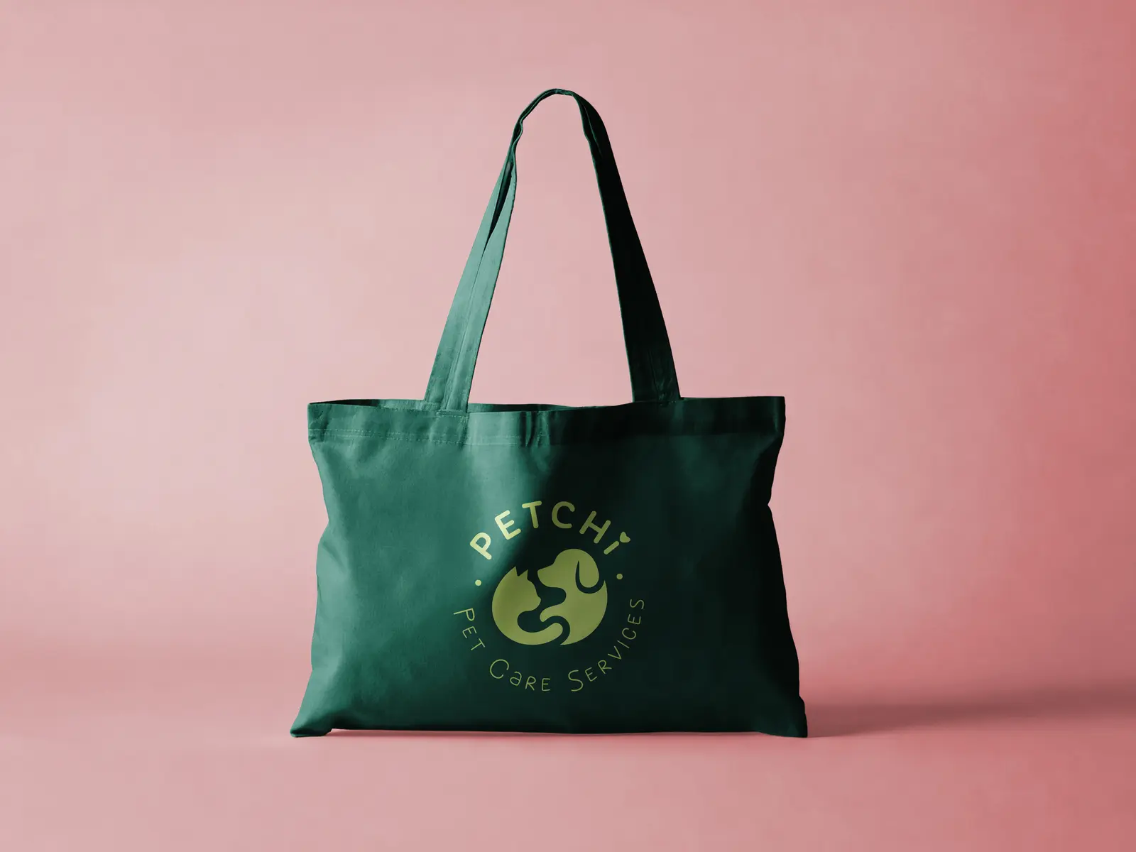 Forest-green Petchi tote on a pink background from the supplied mockup